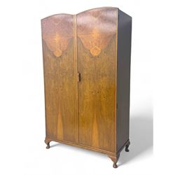 Ashton Leach & Cumberbirch Ltd., Rochdale - early 20th century walnut and mahogany gentleman's wardrobe, arched moulded top with book-matched figured walnut veneers, double doors enclosing fitted interior with hanging rail, tie rack and drawers, raised on cabriole supports