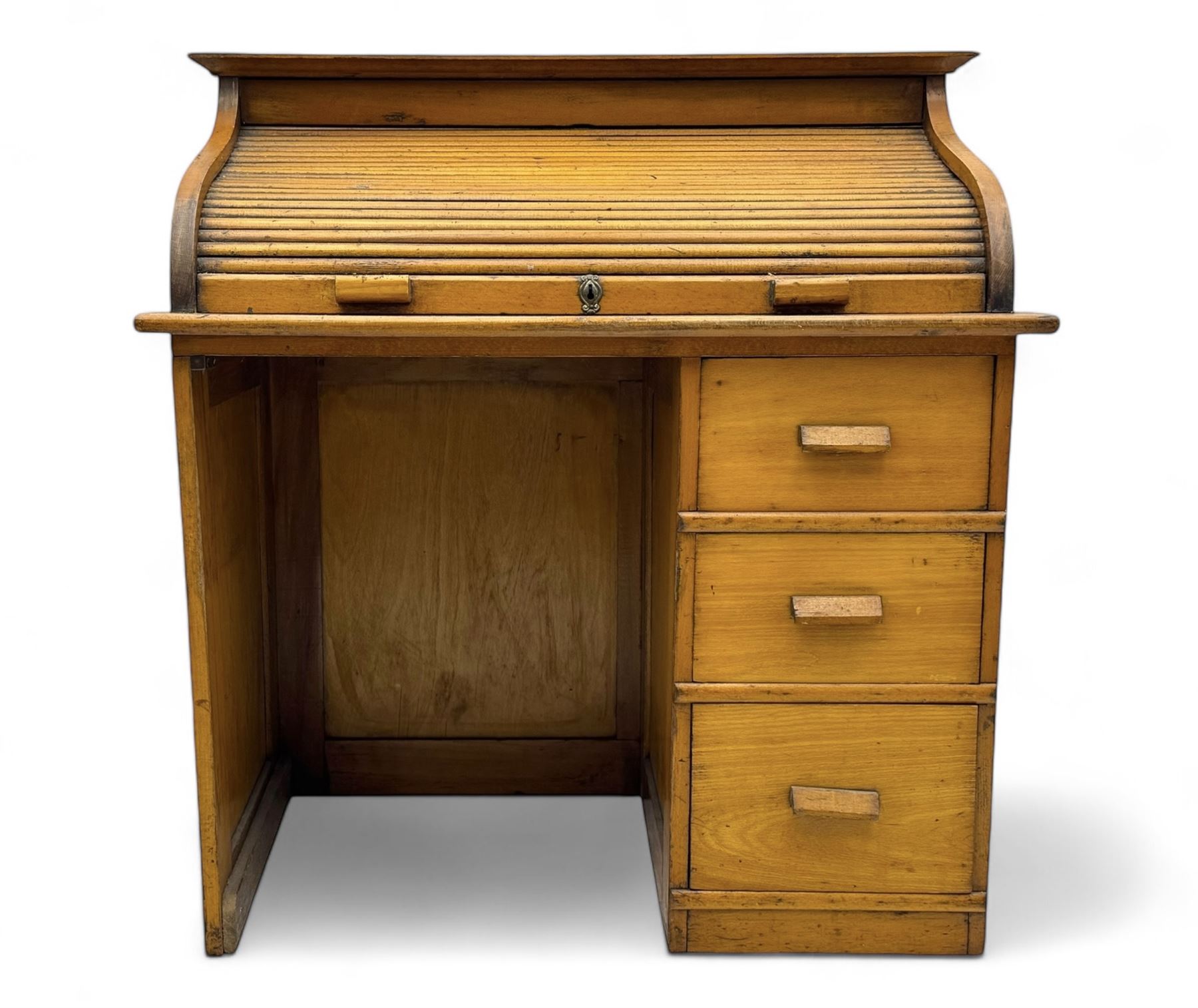 Leeway - late 19th century light oak child's roll-top desk, tambour top opening to reveal fitted interior with green felt writing surface and five pigeonholes, over three graduated drawers on the right side, raised on panelled side supports