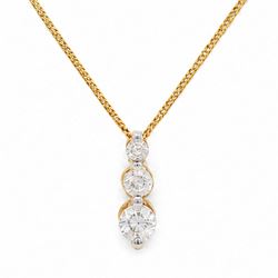 18ct gold diamond pendant necklace, set with three graduating round brilliant cut diamonds...
