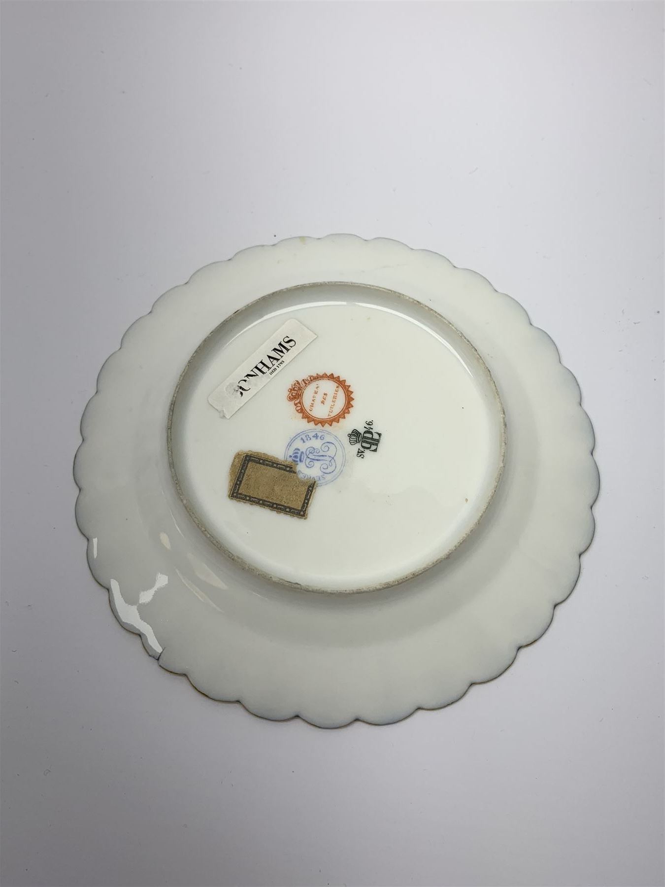 Mid 19th century Sevres Louis Philippe period porcelain cabinet plate, decorated with central Louis Philippe crowned monogram flanked by two cherubs, within cobalt gilt detailed border, with date mark for 1846, red inventory mark for Chateau des Tuileries, and blue monogram mark , D14.5cm