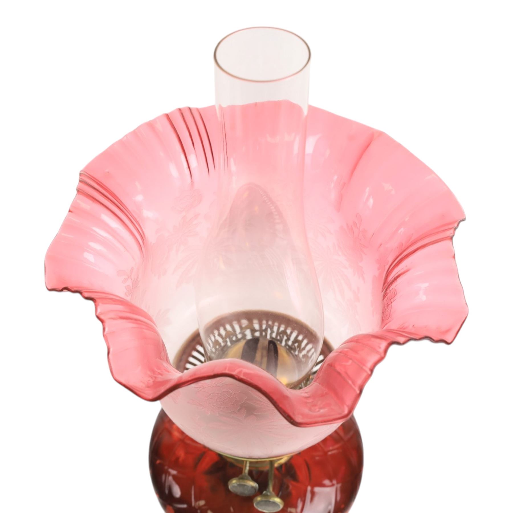 Victorian oil lamp, with etched shade with fluted rim, above a cranberry reservoir, on twisted brass pedestal and decorative base, together with cranberry glass jar, lamp H72cm 