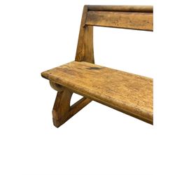 Late 19th century pine pew or bench, single bar back over plank seat and sledge feet