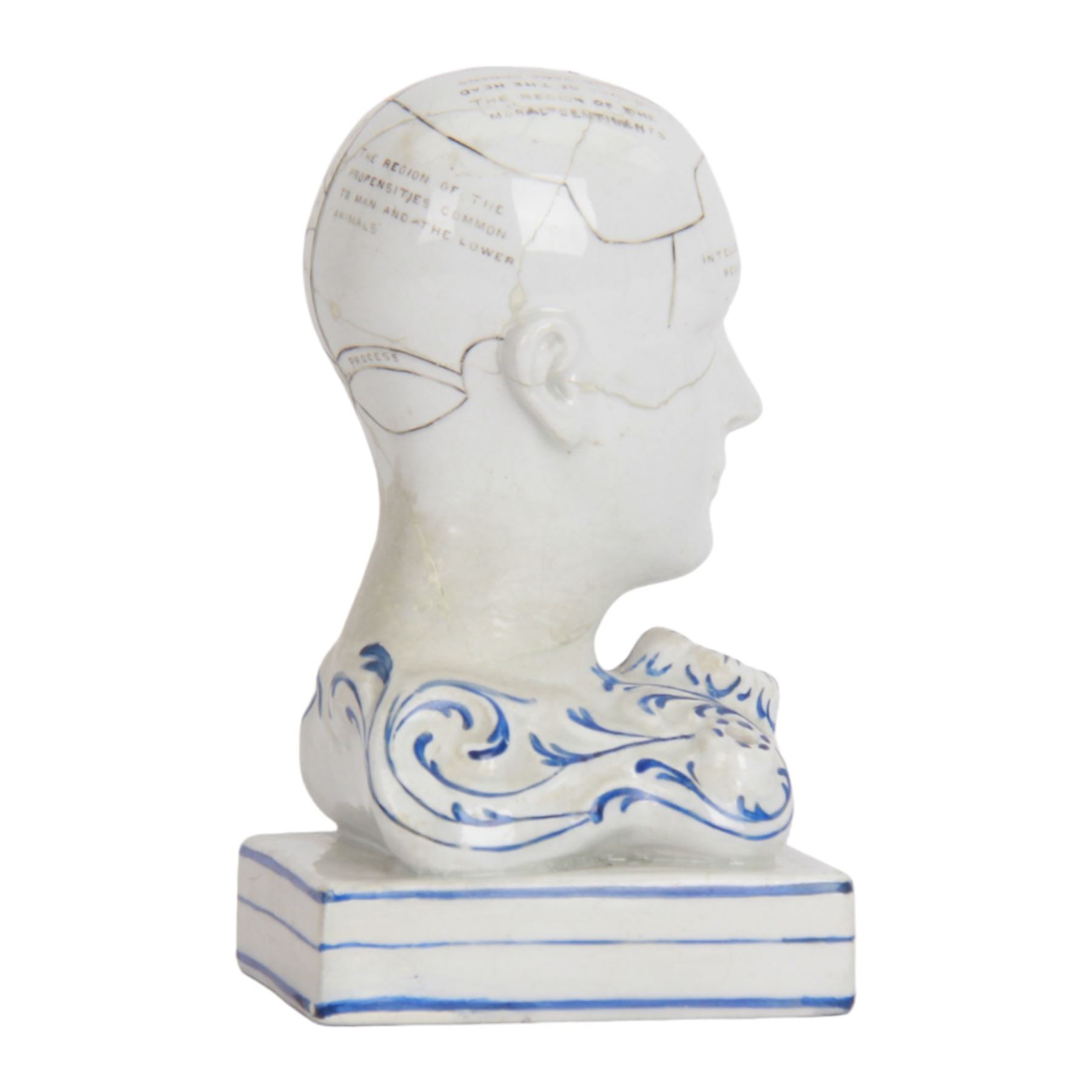 19th century Staffordshire pottery Phrenology head inkwell, circa 1860, the head mapped out, upon a scrolling base with pen/ink recesses and rectangular plinth impressed 'By F. Bridges Phrenologist', H14cm