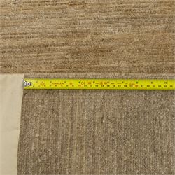 Rugs by Design - ‘Silk Stone’ Nepalese thick pile wool rug, with plain textured camel ground and geometric border detail in blue, grey and dark tones to two sides