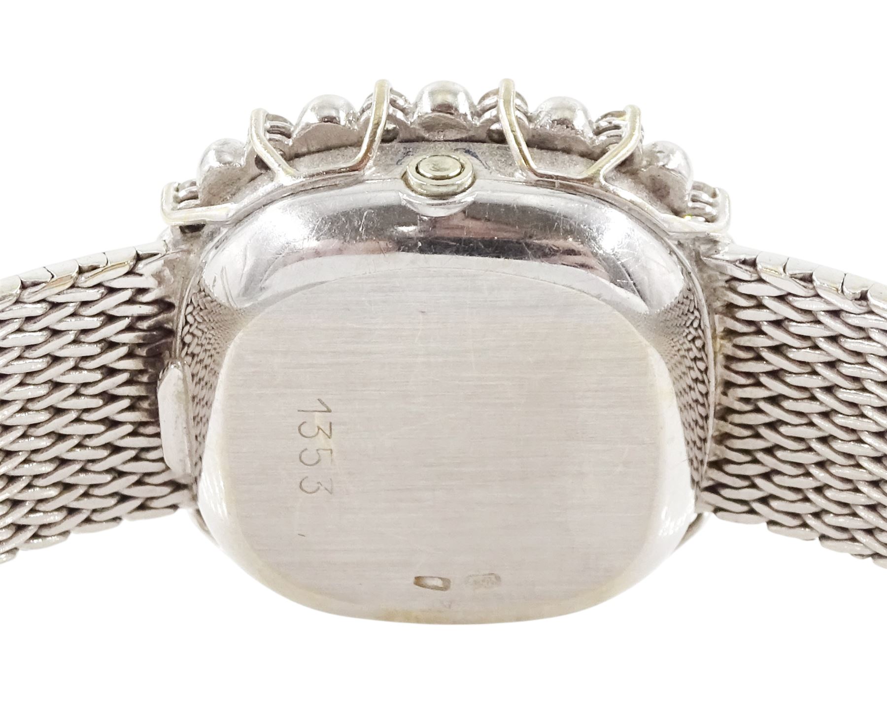 Omega ladies 18ct white gold quartz wristwatch, silvered dial with dot hour markers, round brilliant cut diamond bezel, hallmarked, on integral 18ct white gold bracelet, stamped 750