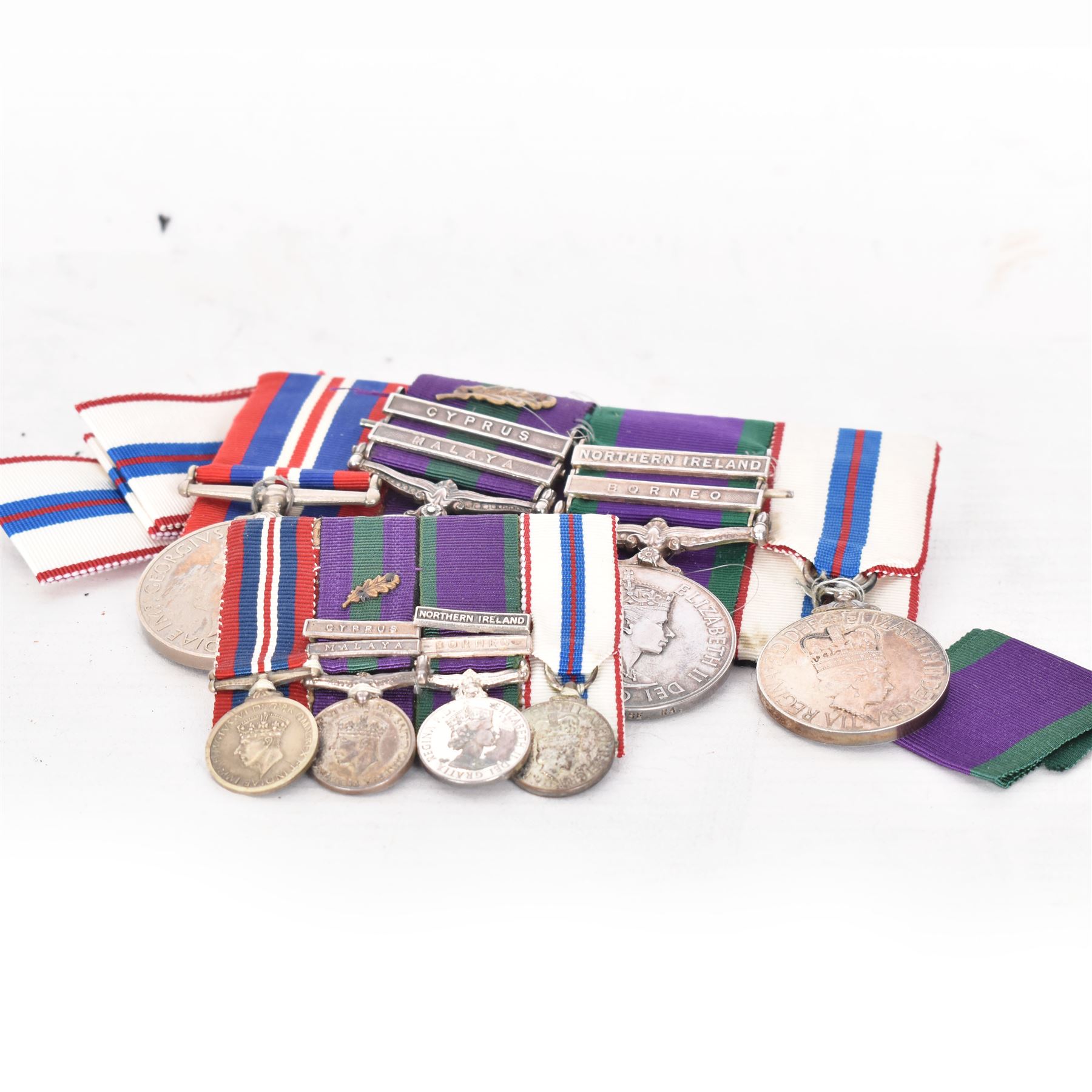 Group of four medals comprising general service medal 1918-62 with Cyprus and GVI Malaya clasps and mid oak leaf awarded to LE. P. Furse RA, general service medal 1962 with Borneo and Northers Ireland clasps awarded to major P.J Furse RA, 1939-45, war medal and ERII 1977 Jubilee medal, together with three matching group of miniatures, mid certificate and 2nd Lieutenant commission award certificate 