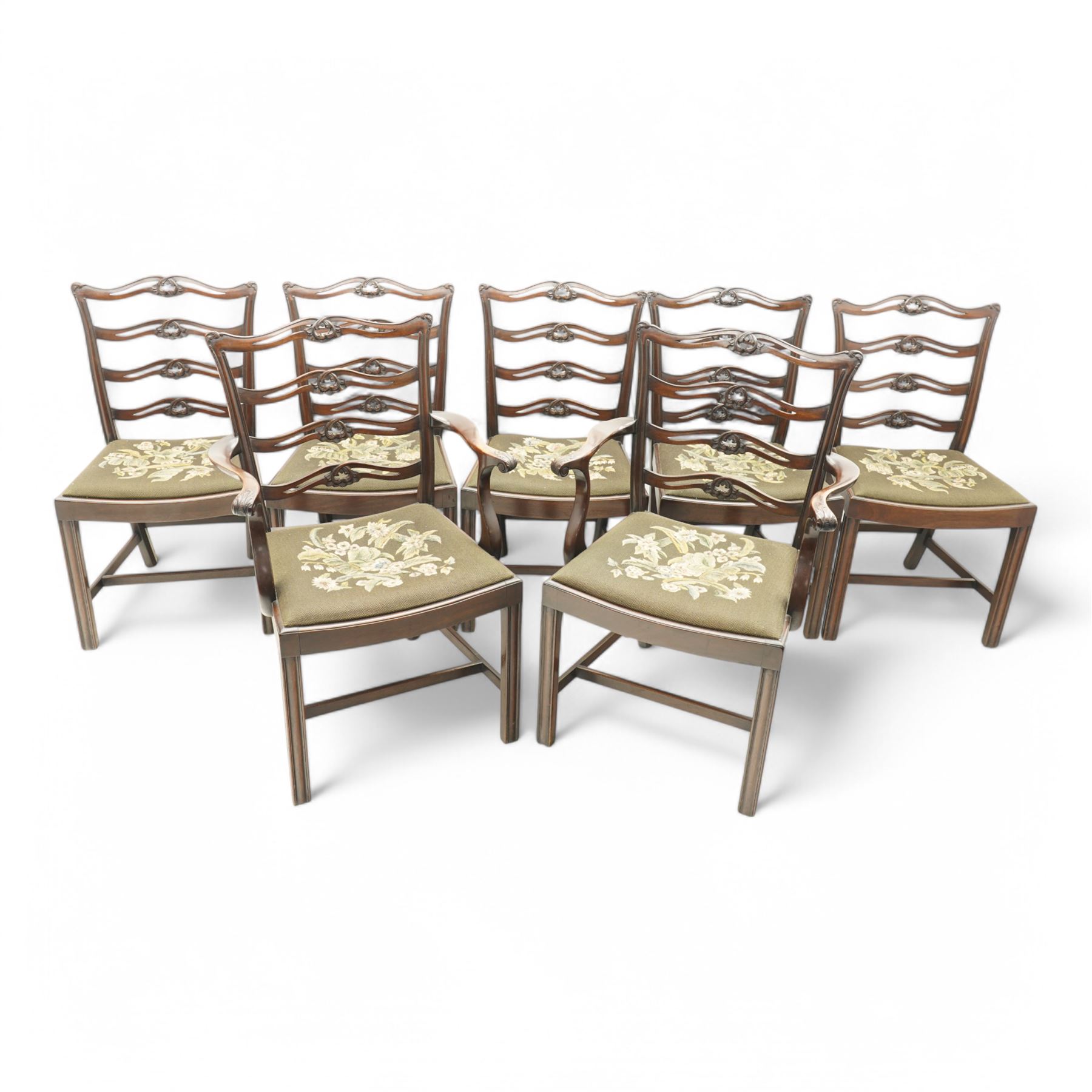 Set of eight (6+2) early 20th century Chippendale design mahogany dining chairs, waved and pierced ladder back carved with shells and curled leaves, moulded upright rails, dished seats with upholstered drop-in seat cushions, on square moulded supports united by plain stretchers 