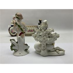Group of 18th and 19th century ceramics for repair and restoration, to include an 18th century Derby figure emblematic of the Continent of Africa, pair of small 19th century Derby vases, painted with birds and floral spray, 19th century Derby slop bowl decorated in the 594 pattern with pink roses against gilt trellis, 19th century Derby figure of a recumbent deer, Serves style box, and two further figures