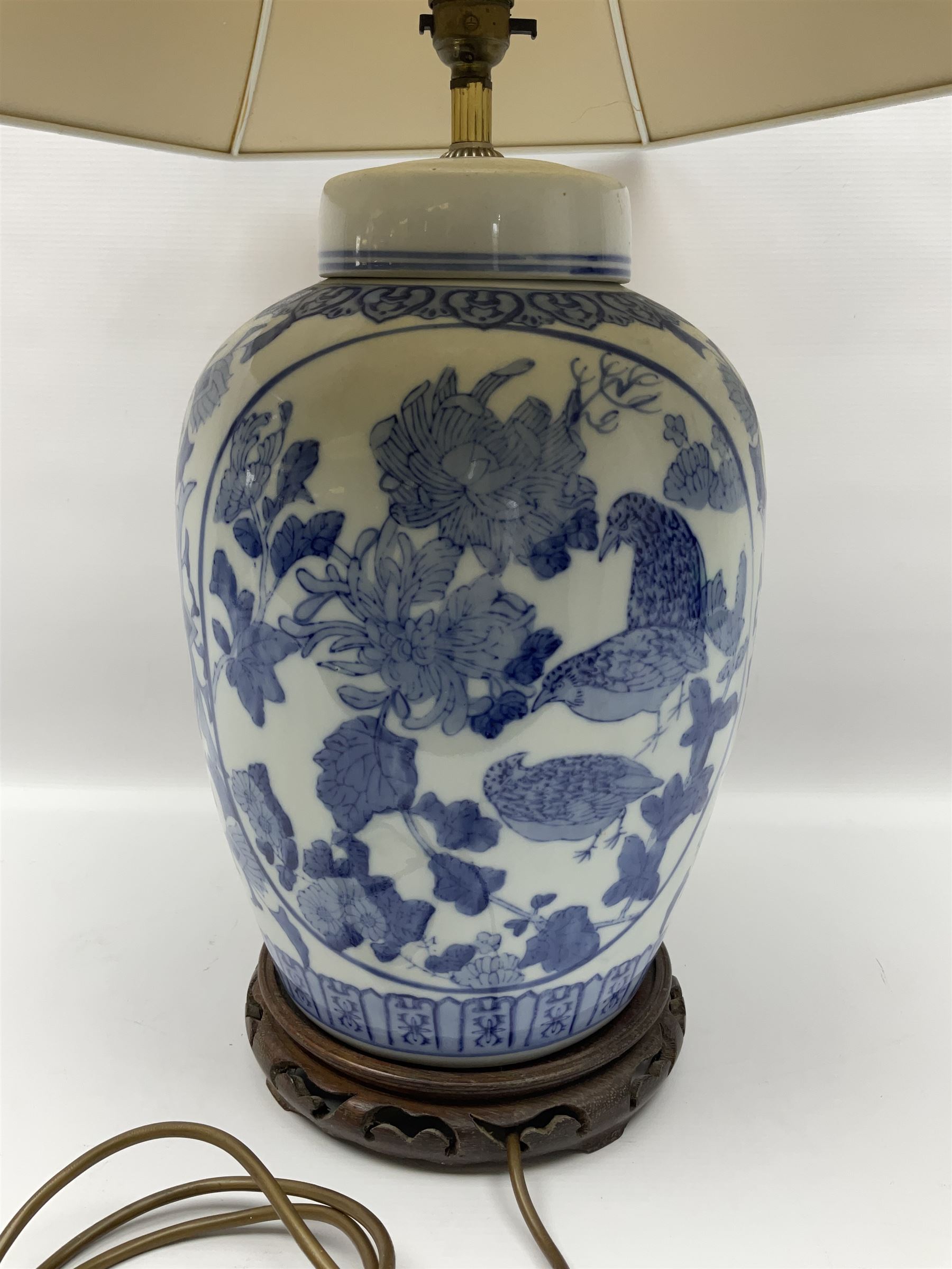 Chinese blue and white table lamp of baluster form, decorated with birds and floral displays, on hardwood base with shade, H78cm