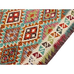 Anatolian Turkish Kilim multi-colour rug, decorated with all over lozenges in contrasting colours with ivory outline, the multi-band ivory border with repeating geometric shapes and small lozenges or diamonds