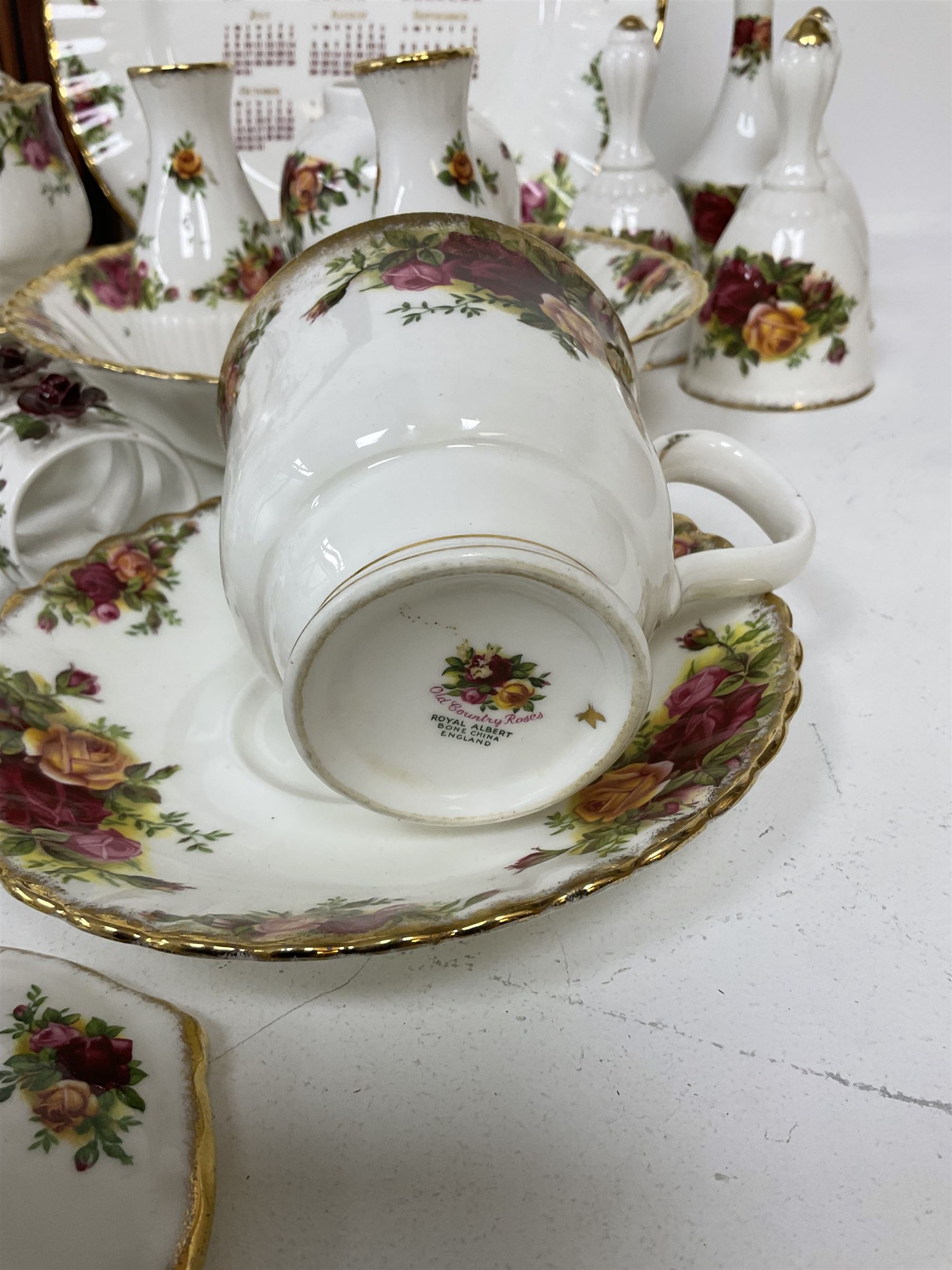 Royal Albert Old Country Roses pattern ceramics, to include table lamp, lidded vase, two pairs of salt and pepper shakers, cups and saucers, plates, biscuit jar, bowls, lidded preserve pot, vases, dishes, knives, napkin rings, lidded jars and box, pair of candlesticks etc