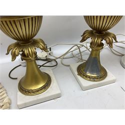 Three table lamps, of urn form with acanthus detail, two upon square base, the other upon circular base, (a/f), approximately H56cm, together with a pair of cream lace lampshades.