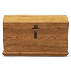 Early 20th century pine coffer, domed lid over plain front and sides with exposed dovetail...
