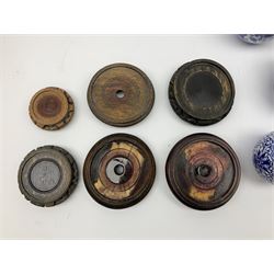 Six Chinese ginger jars, predominantly of blue and white design decorated with blossoming branches, all with lids, housed on various hardwood carved stands, some with character marks beneath