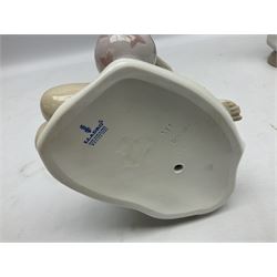 Three Lladro figures, comprising Modern Mother no 5873, Dropping the Flowers no 1285 and On the Beach no 1481, all with original boxes, largest example H30cm