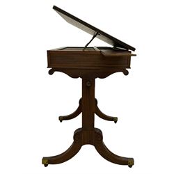 Regency mahogany rise-and-fall architect's table, adjustable hinged top on brass mechanism with reeded edge moulding, plain recessed frieze panels concealing full length drawer with division and slide at each side, moulded solid end supports joined by two turned stretchers, on splayed and tapering lobe carved supports with brass cups and castors 