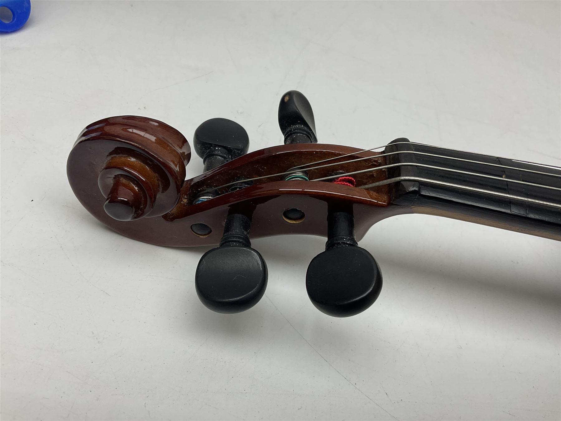 Four student violins - two Chinese three-quarter size with 33.5cm and 34cm two-piece backs; Stringers of Edinburgh quarter size with 28cm two-piece back; and Stentor quarter size with 28cm two-piece back; each in carrying case (4)
