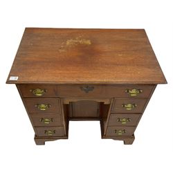 George III style mahogany kneehole desk, fitted with seven drawers and 'dog kennel' cupboard