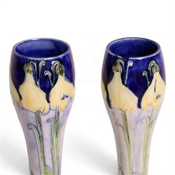 William Moorcroft for James MacIntyre, Pair of Florian Ware Snowdrop vase, circa 1902, waisted elongated gourd form, printed mark and green signature