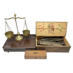 Quantity of oil and sharpening stones in wood box, pair of brass tabletop scales, canteen box and smaller box