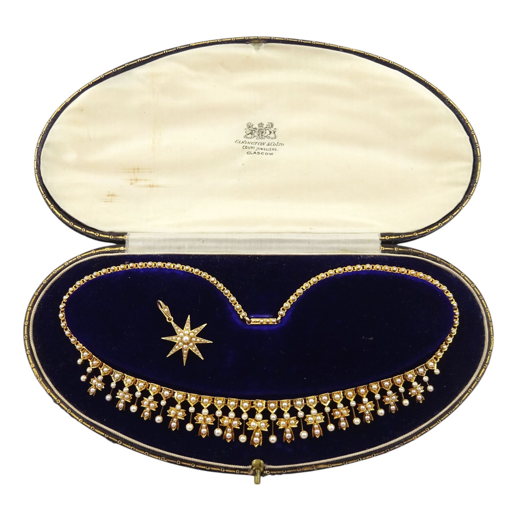 Edwardian 15ct gold split pearl fringe necklace, thirteen graduating cross pendants, each spaced by pearl drops, the centre cross suspending an 18ct gold pearl star pendant, to a pearl set chain necklace, in silk and velvet lined case by Elkington, Glasgow