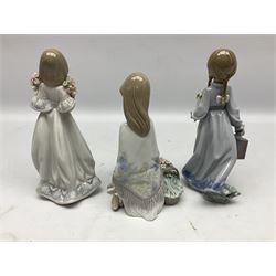 Three Lladro figures, comprising Flower Song no 7607, Spring Bouquets no 7603 and School Days no 7604, with original boxes, largest example H22cm 