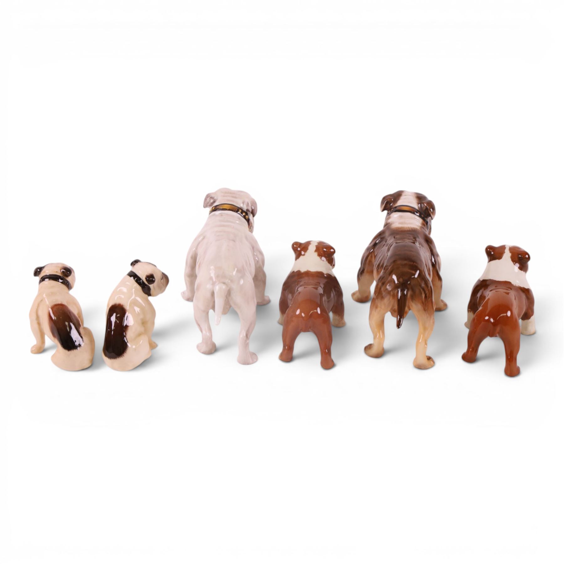 Two Royal Doulton Brindle bulldogs,1047, together with a pair of Beswick Bosun bulldogs and two others 