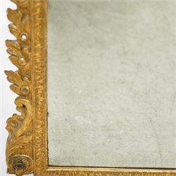 19th century George III style giltwood overmantel mirror, the rectangular bevelled plate within a moulded frame decorated with acanthus leaf and floral scroll carving to the corners, and sides flanked by two girandole sockets 