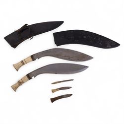 Two bone handled kukris with three small blades