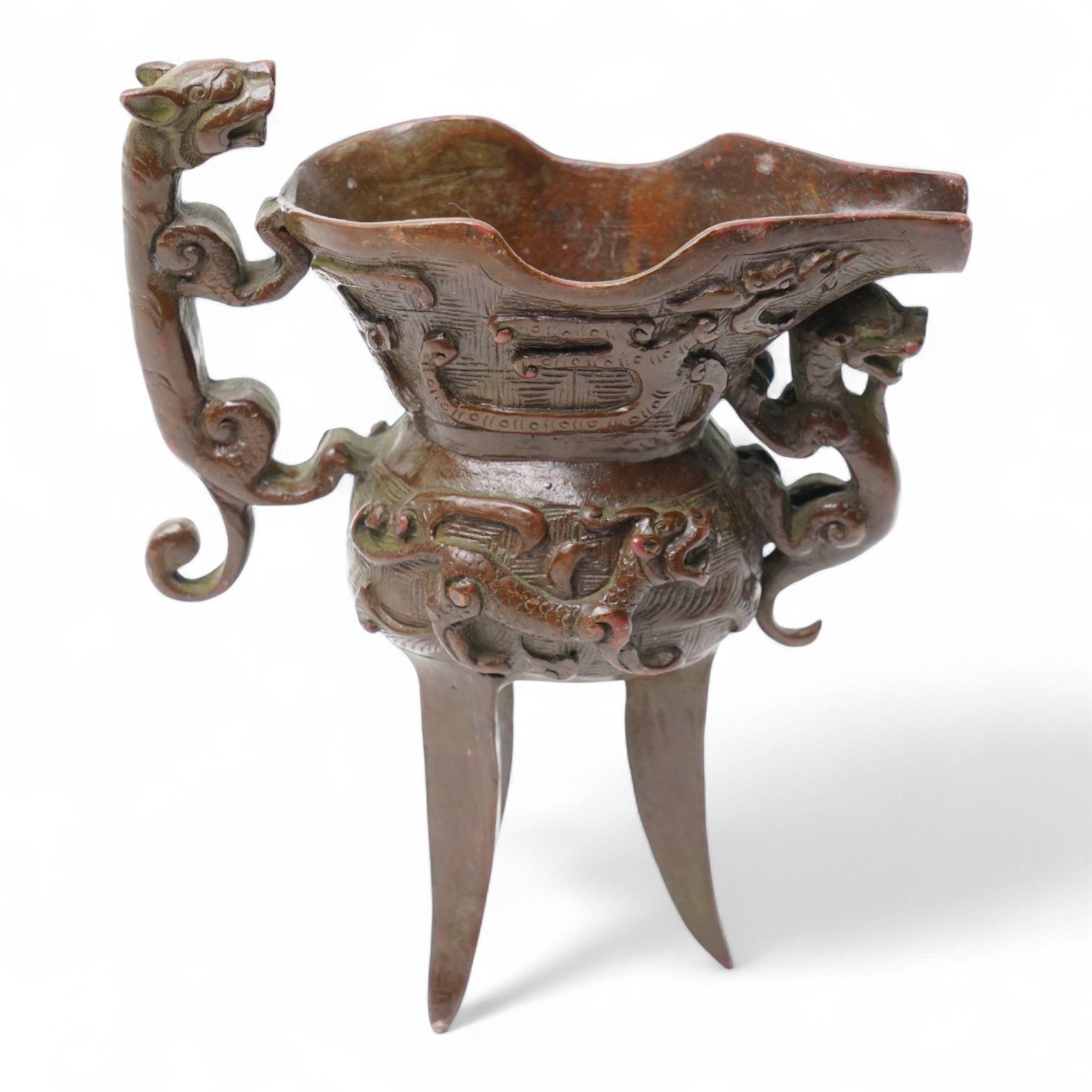 Chinese bronze libation cup with Zoomorphic handle on a tripod base H13cm