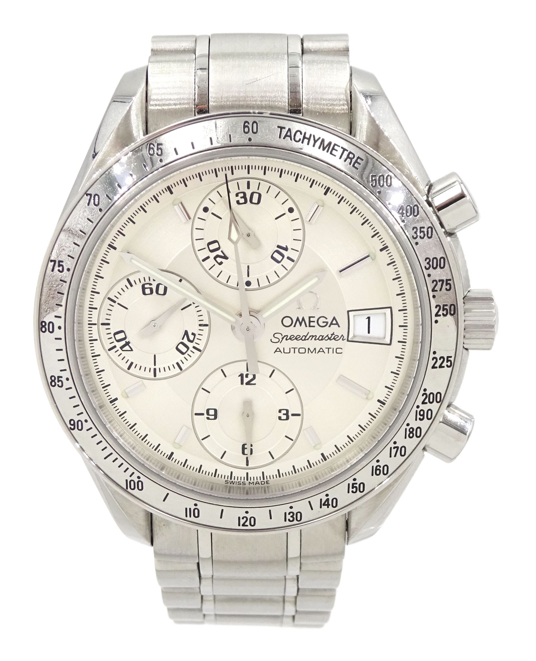 Omega Speedmaster gentleman's stainless steel automatic chronograph wristwatch, back case No. 175.0083, serial No. 57498920, silvered dial with date aperture and subsidiary dials for constant seconds, 30 minute and 12 hour register, stainless steel tachymetre scale bezel, on Omega stainless steel bracelet, with fold-over clasp, with warranty card