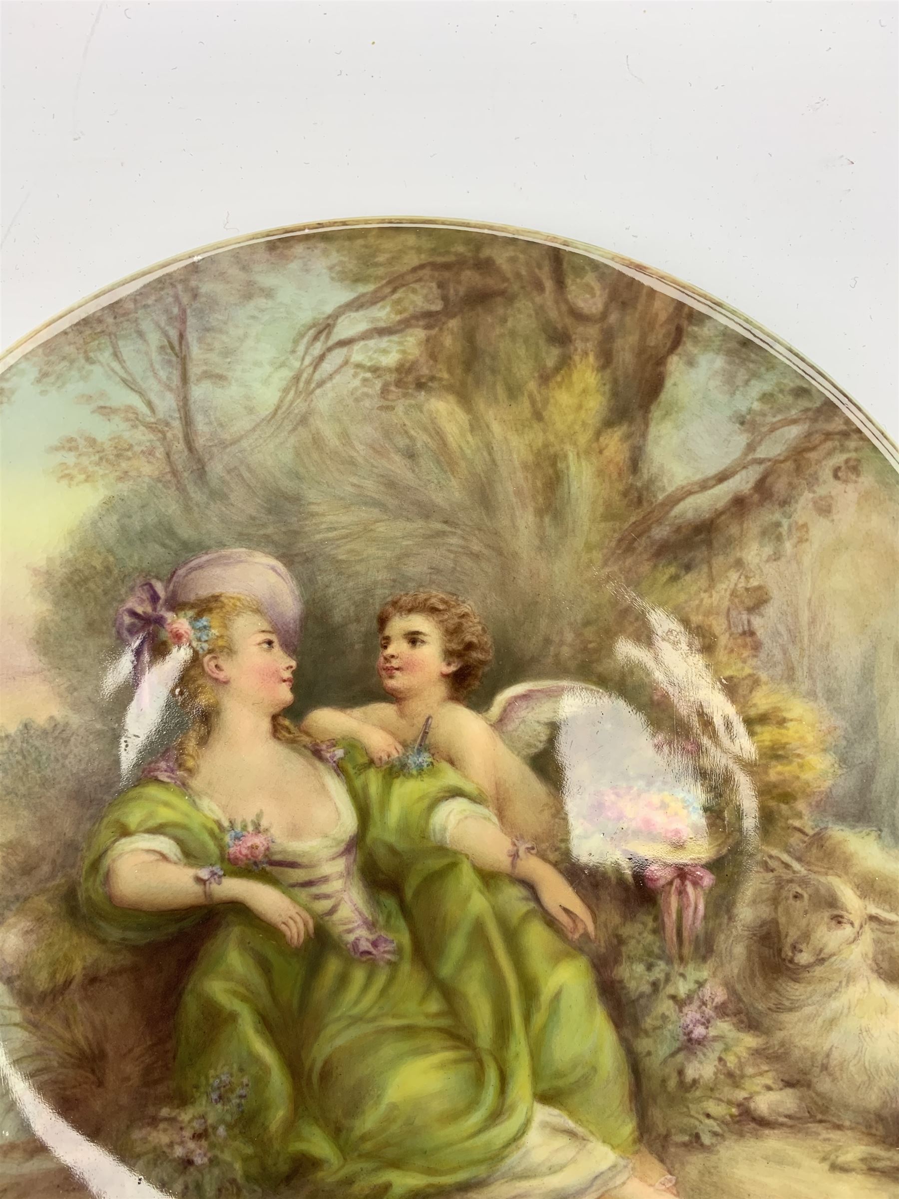Late 19th century porcelain plate, hand painted by Frederick Sutton, depicting a female figure and putto within a wooded landscape, with recumbent sheep and brook to the fore, signed F N Sutton, unmarked verso, D22.5cm

Frederick Sutton was employed as a painter at the notable factories of Royal Worcester, Coalport, and Minton. 
