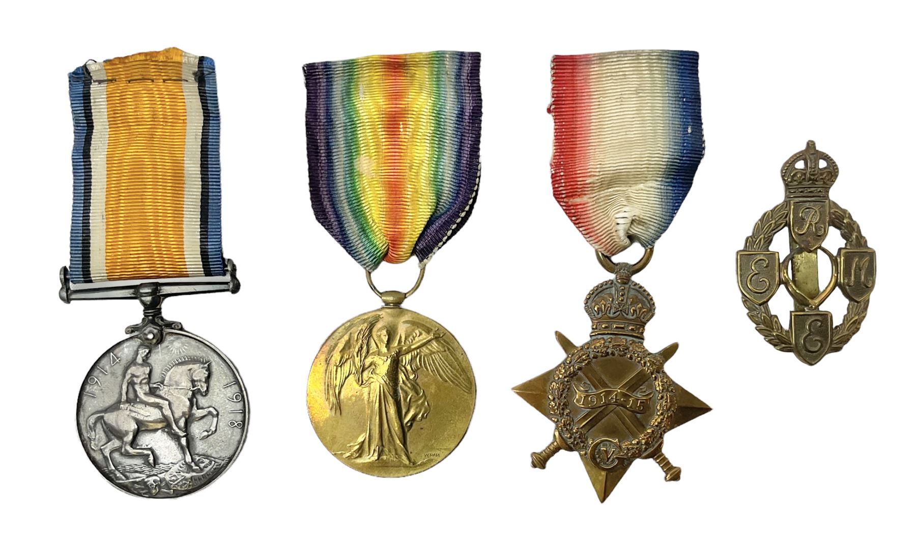 Three WW1 medals comprising 1914-15 Star awarded to 58648 Spr. C. Roberts R.E.; British War Medal and Victory Medal awarded to 87502 1.A.M. C. Roberts R.F.C.; and REME cap badge (4)