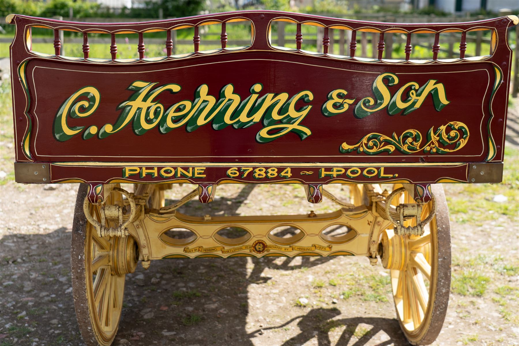 Advertising Trade Dray Wagon for C. Herring & Son, Hartlepool, Dated 1895 and Renovated 1975

An exceptionally decorative late Victorian horse drawn advertising trade dray, built by J. Herring of Hartlepool in 1895 and later renovated by C. Herring in 1975, as recorded by the painted inscription beneath the body. Finished in a striking cream and maroon livery with extensive hand painted signwriting, the wagon carries the name C. Herring & Son, Iron & Steel Processors, Hartlepool along its sides and rear panels. The wagon is fitted with a flat timber loading bed, twin shafts for a single horse, elegant spoked wooden wheels, iron bound tyres, rear headboard and traditional undercarriage with leaf spring suspension. Richly detailed scrollwork and lining throughout make this a particularly attractive example, suitable for collection, display, museum, promotional or coaching purposes.

Features

• Built by J. Herring, Hartlepool, 1895
• Renovated by C. Herring in 1975
• Original style hand painted advertising signwriting
• Flat timber loading platform
• Raised rear headboard with decorative pierced gallery
• Twin shafts for a single horse
• Wooden spoked wheels with iron tyres
• Traditional leaf spring suspension
• Extensive decorative lining and scrollwork throughout
• Attractive cream and maroon colour scheme
• Suitable for private collection, museum or display use

Dimensions:
Overall length: 560 cm
Body length: 300 cm
Width: 158 cm
Height: 150 cm

Wheel Diameters:
Front wheels: 76 cm
Rear wheels: 86 cm
