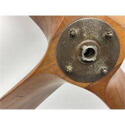 British World War II era laminated wooden four-bladed generator propeller, late 1930s-40s, used to power a drogue winch used by a target tug aircraft; marked with DRG drawing number T29505-2-4 N760 on the hub and impressed circle mark 'P.M.P.W. 1'; light weight four plank mahogany laminate with 9.5cm diameter metal plates mounted to front and rear faces of hub for 15mm shaft; one plate marked T29504-2/198 D91cm; together with a modern reproduction brass edged mahogany two-blade propellor L