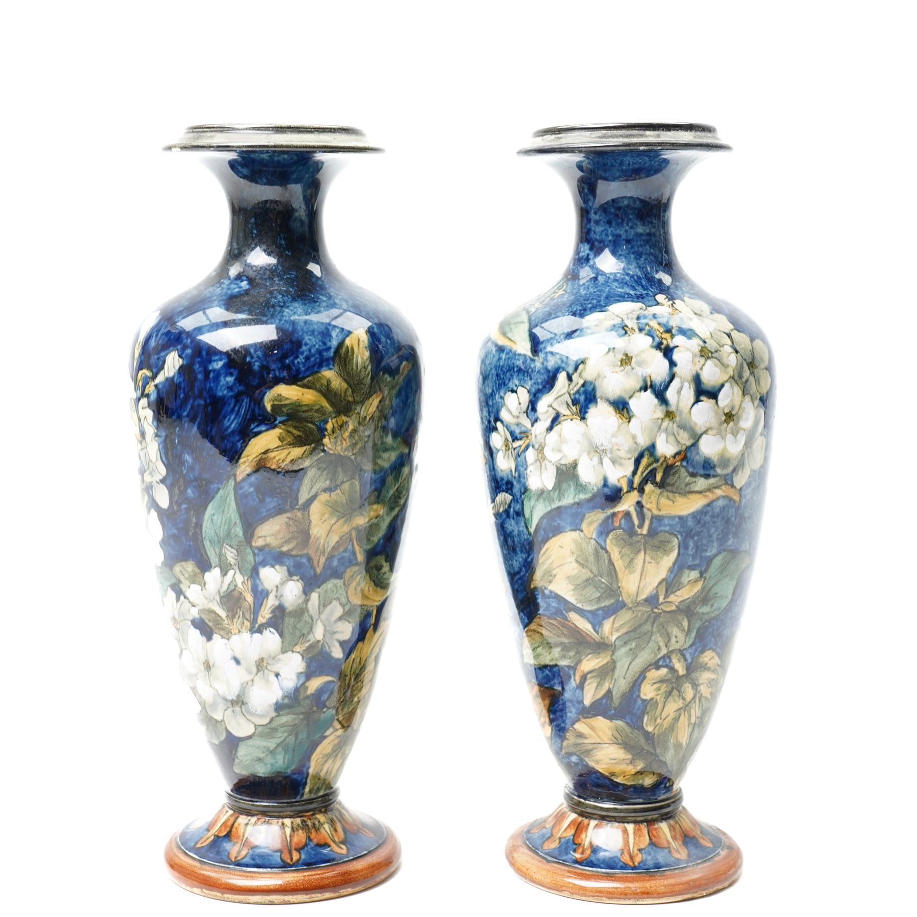 Pair of Doulton Lambeth vases, painted with white flowers, impressed marks to base and signed MA, for Mary Aitken, 1878, H28cm (2)