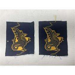 Royal Arms cloth arm adge as worn by Regimental Serjeant-Majors in Foot Guards; naval cap badge; WW2 Commando/Special Forces cloth badges; Home Guard and LDV shoulder titles; and other cloth badges including armoured division, 45th and 77th division, 52nd Lowland Mountain division etc; and 24th Infantry Brigade airmobile pennant