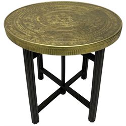 Indian brass topped folding benares table, circular top embossed with foliate and scrolling decoration, reeded supports