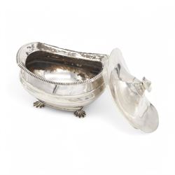 1920s silver sucrier and cover, of oval form with oblique gadrooned rim, the cover with rectangular finial, upon four splayed feet, H10.5cm