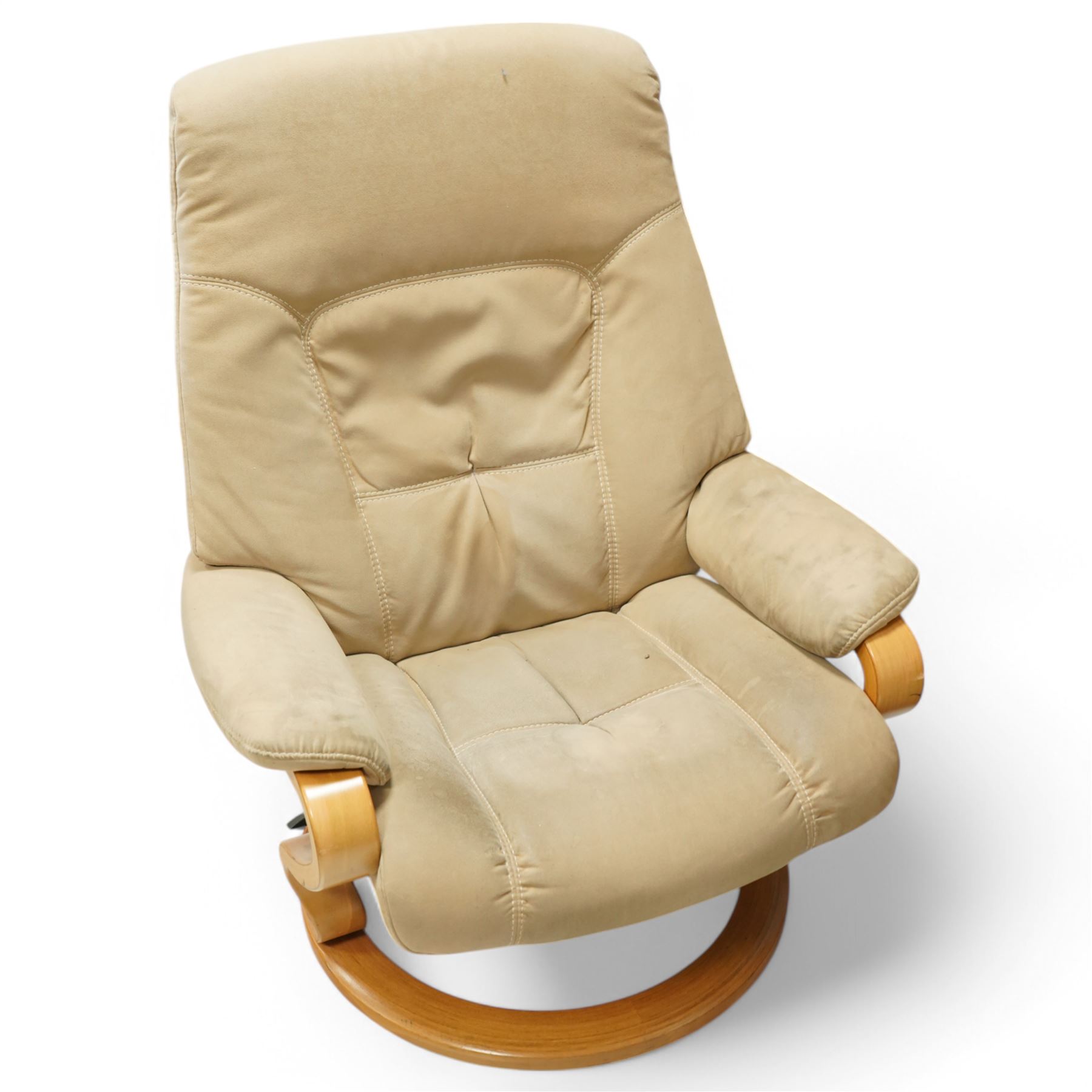 Himolla - A pair of swivel reclining chairs, beige upholstered with padded arms and high back rest, raised on a laminated circular wooden base with swivel mechanism 