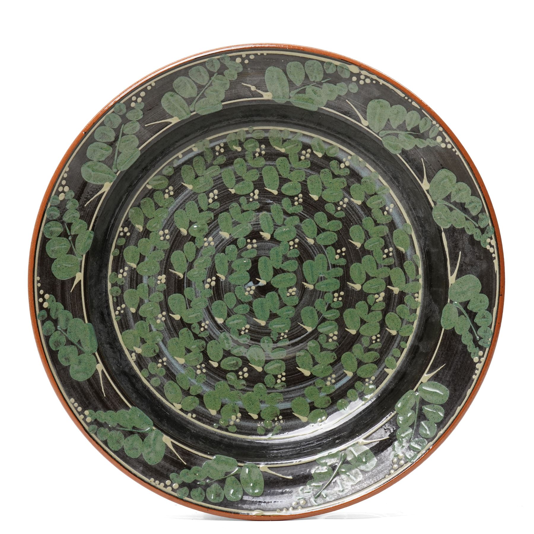 Richard Phethean (1953-): Slipware charger, decorated with green foliage on a black ground, D40cm 