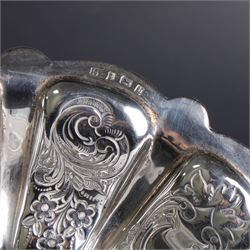 Edwardian silver swing handled basket, of circular form with shaped rim and engraved floral and foliate decoration, with know design swing handle and upon circular stepped pedestal, hallmarked J Sherwood & Sons, Birmingham 1901, H9cm, D22cm