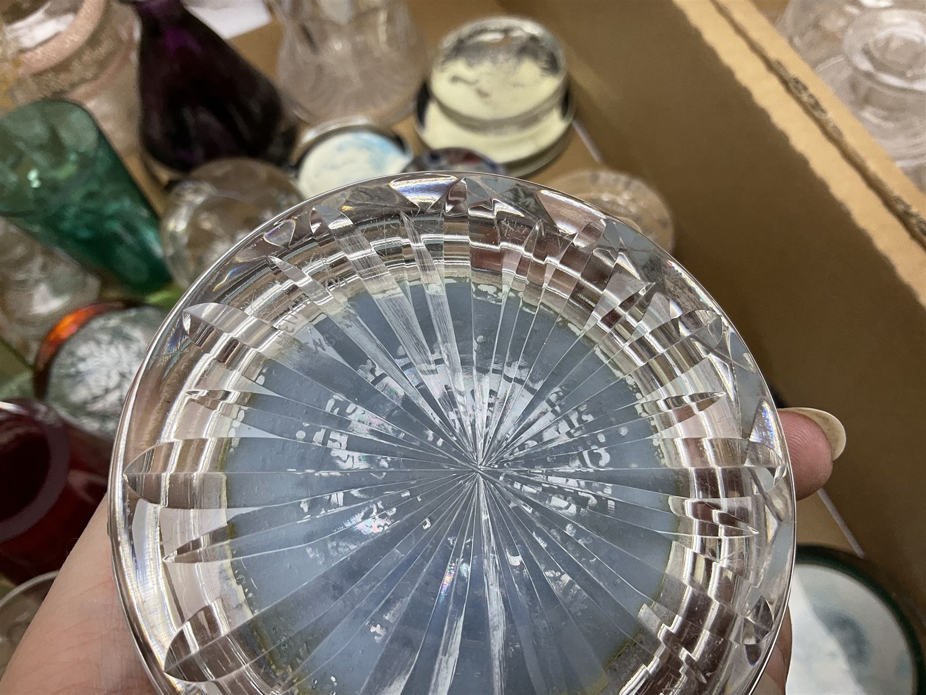 Millefiori paperweight, together with Caithness paperweight, Isle of Wight vase, cranberry glass tumblers, claret jug, decanters and other glassware, in three boxes 