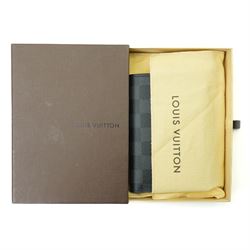 Louis Vuitton Damier Graphite canvas passport holder, the black and grey checkerboard exterior opening to a crossgrain leather interior with card slots and slip pockets, stamped Louis Vuitton Paris and made in Spain, together with original Louis Vuitton box and dust cloth