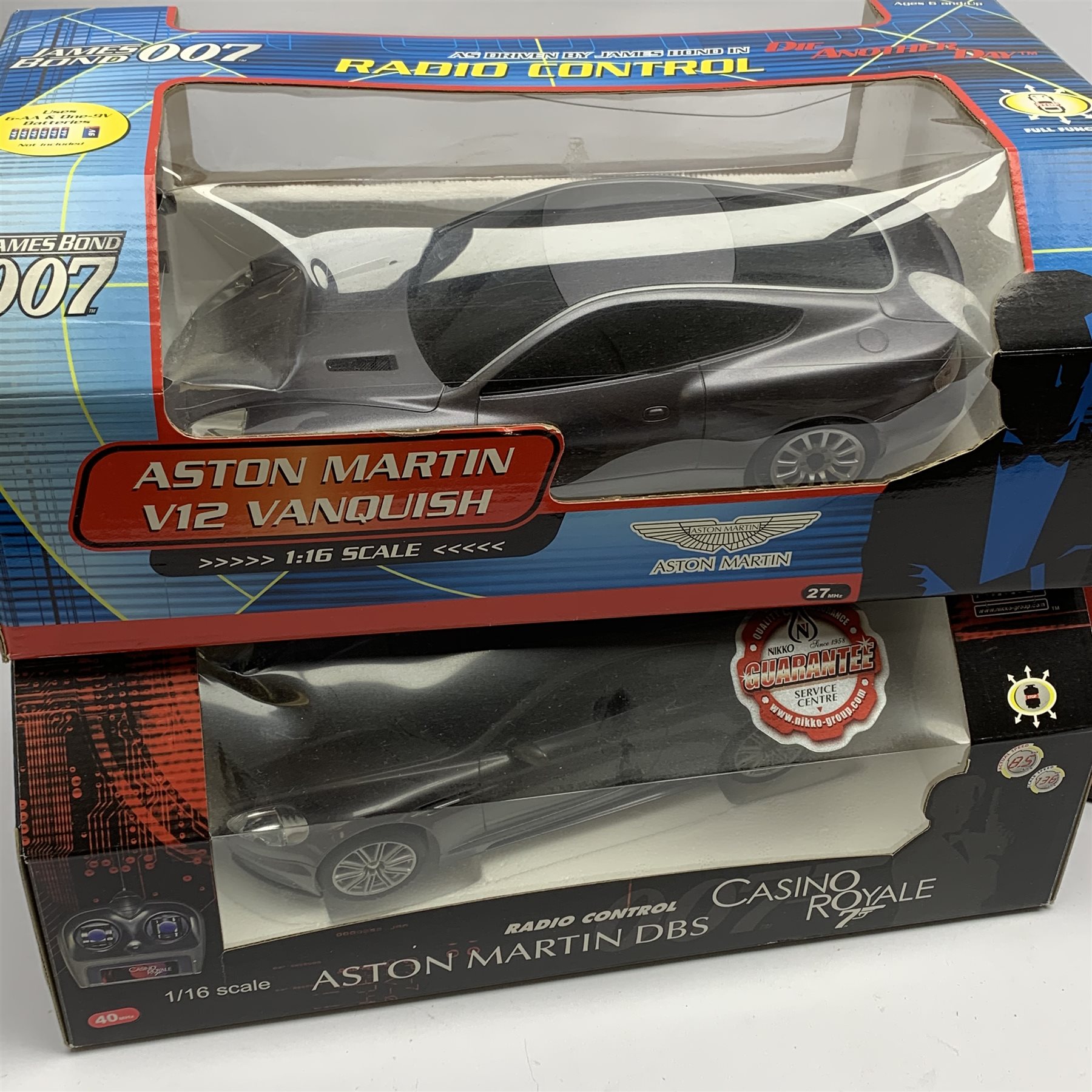 Two Nikko 1:16th scale James Bond radio controlled die-cast model cars - Aston Martin from Casino Royale and Aston Martin V12 Vanquish from Die Another Day; IMC 007 Walkie-Talkie Set; and Galoob MicroMachines 007 set with vehicles from Goldfinger, Moonraker, The Spy Who Loved Me, all boxed (4)
