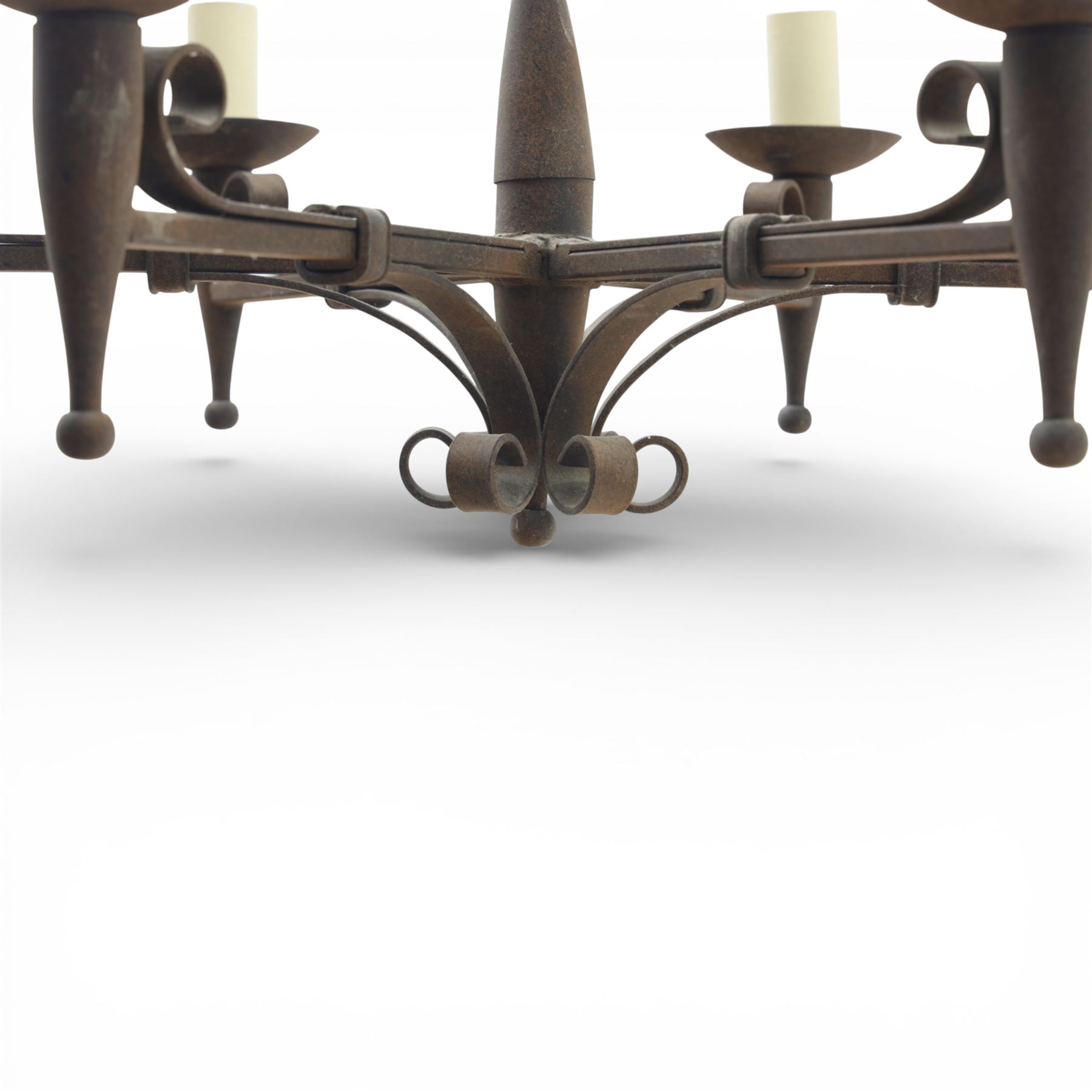 20th century wrought iron six branch chandelier, the central baluster stem issuing six scrolling arms supporting circular drip pan with drop terminals