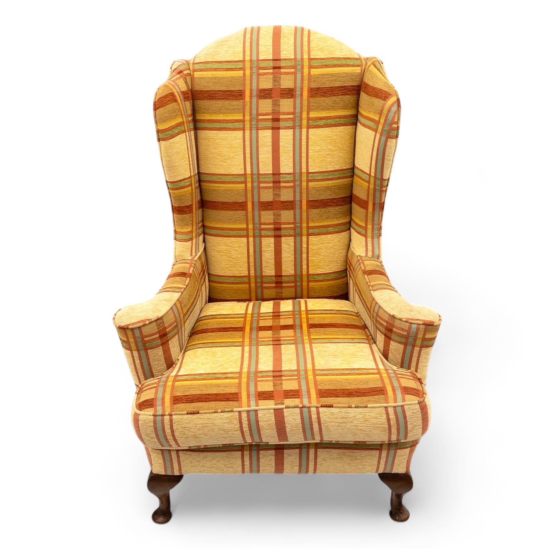 20th century Georgian style upholstered wingback armchair with footstool, the chair in yellow and red plaid fabric, the stool with fringed tapestry cover