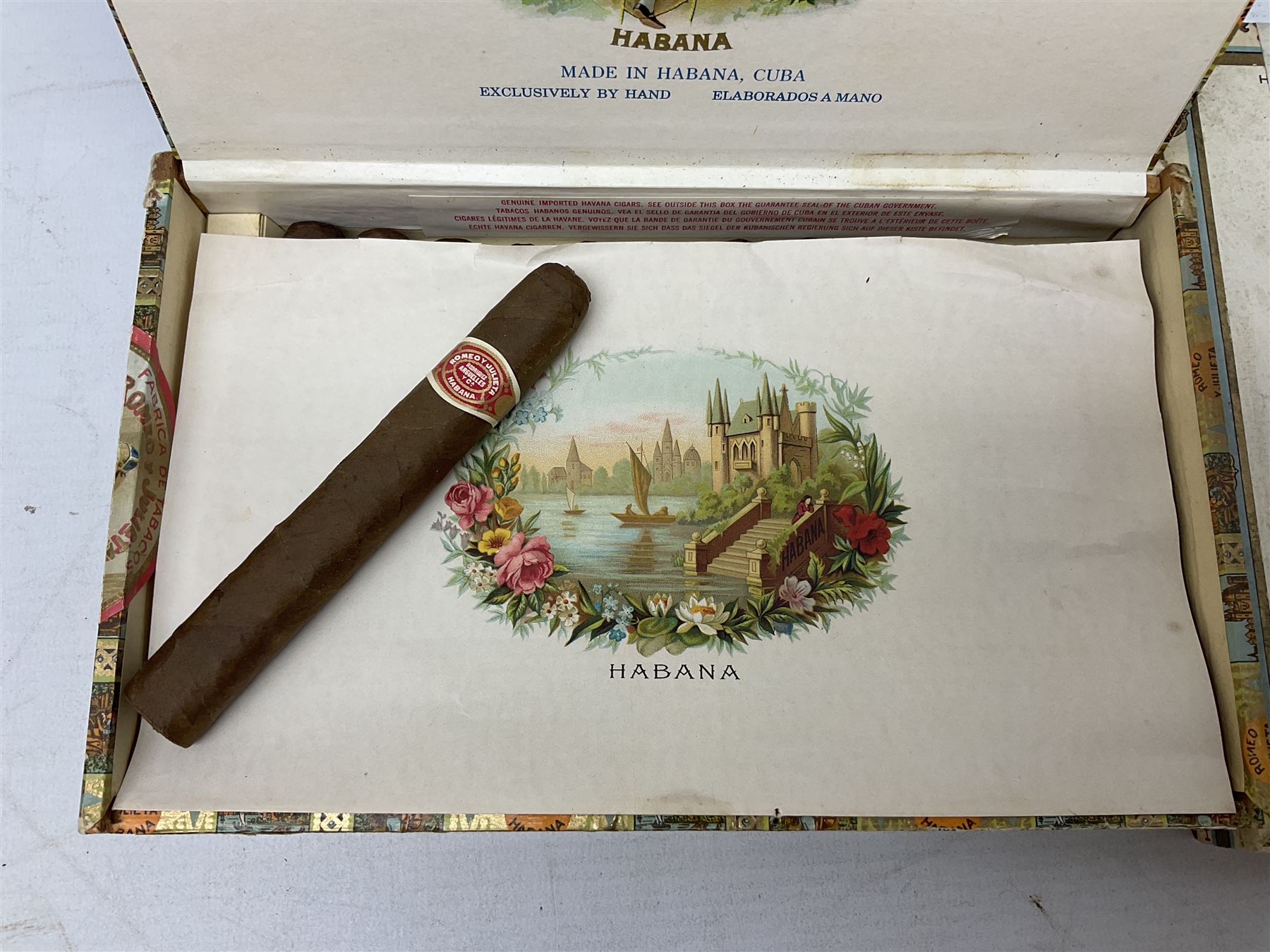 Victorian leather cigar protector with metal match striking plate on the end, and quantity of boxed cigars, comprising Willem II Churchill cigar, Willem II double dutch, Quintero Y Hno Habana cigars and Romeo Y Julieta, habana