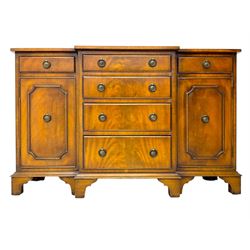 Georgian design mahogany break-front sideboard, fitted with six drawers and two cupboards, on bracket feet 