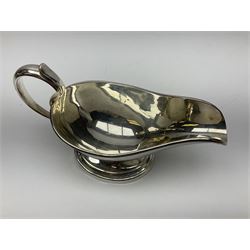 Christofle silver-plated sauce boat, of typical plain form, with capped C scroll handle and engraved anchor crest to body, upon a stepped oval foot, stamped 22 Christofle to base, including handle H14cm